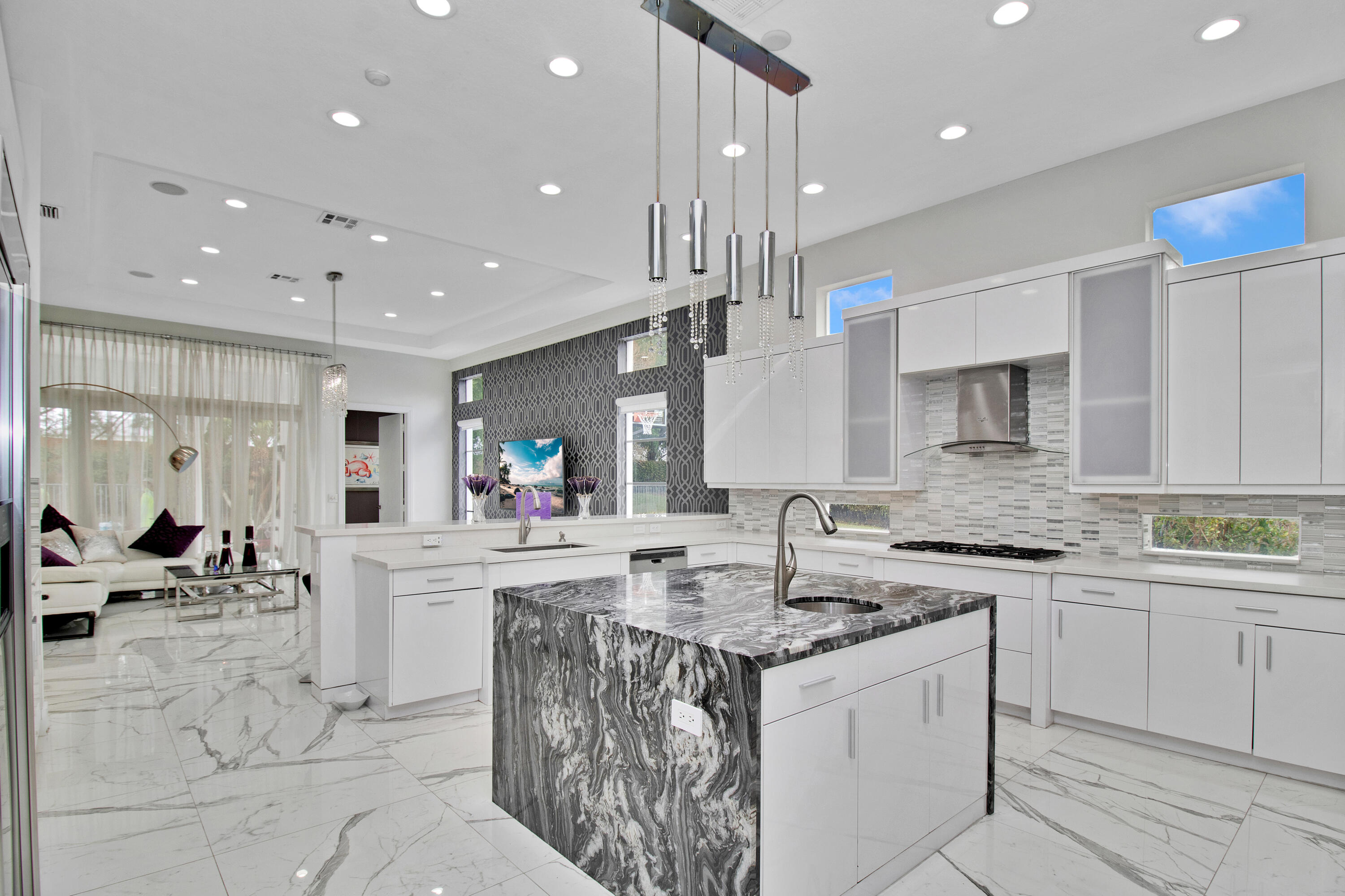 17729 Middlebrook Way Boca Raton, FL 33496 - Photo 29 of 88 a kitchen with stainless steel appliances granite countertop a sink stove and cabinets