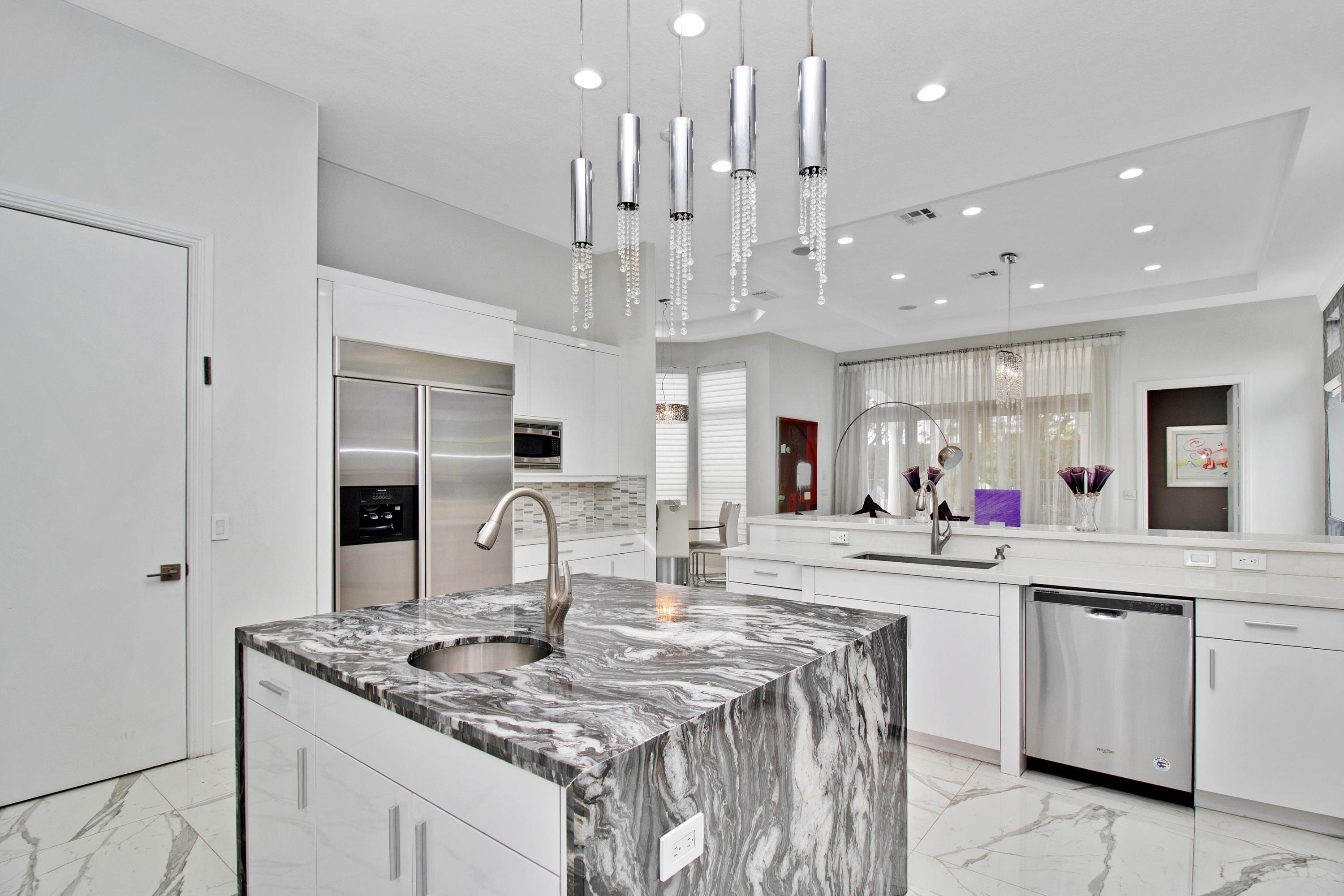 17729 Middlebrook Way Boca Raton, FL 33496 - Photo 30 of 88 a kitchen with stainless steel appliances kitchen island granite countertop a sink and cabinets