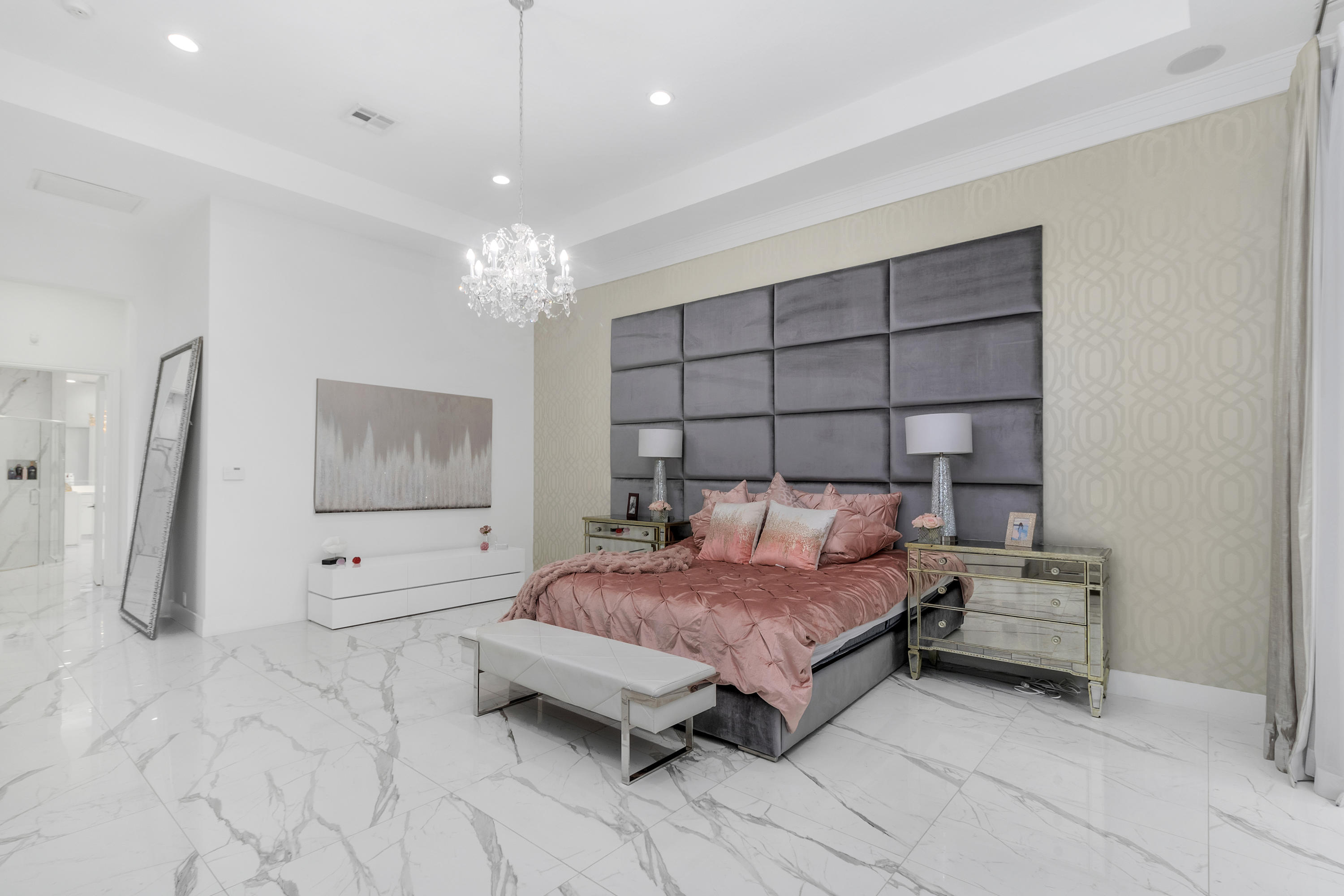 17729 Middlebrook Way Boca Raton, FL 33496 - Photo 39 of 88 a bedroom with a bed and a chandelier