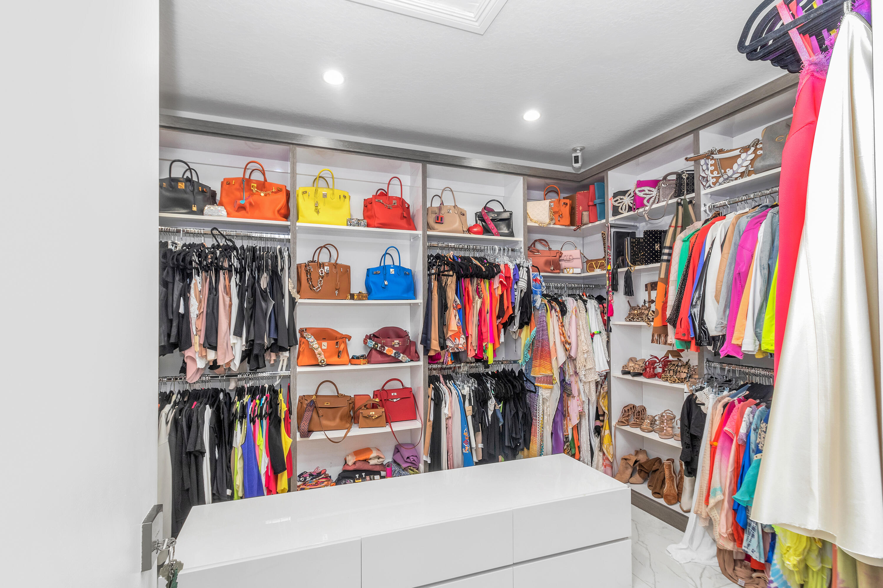 17729 Middlebrook Way Boca Raton, FL 33496 - Photo 41 of 88 a view of walk in closet with clothes and shoes