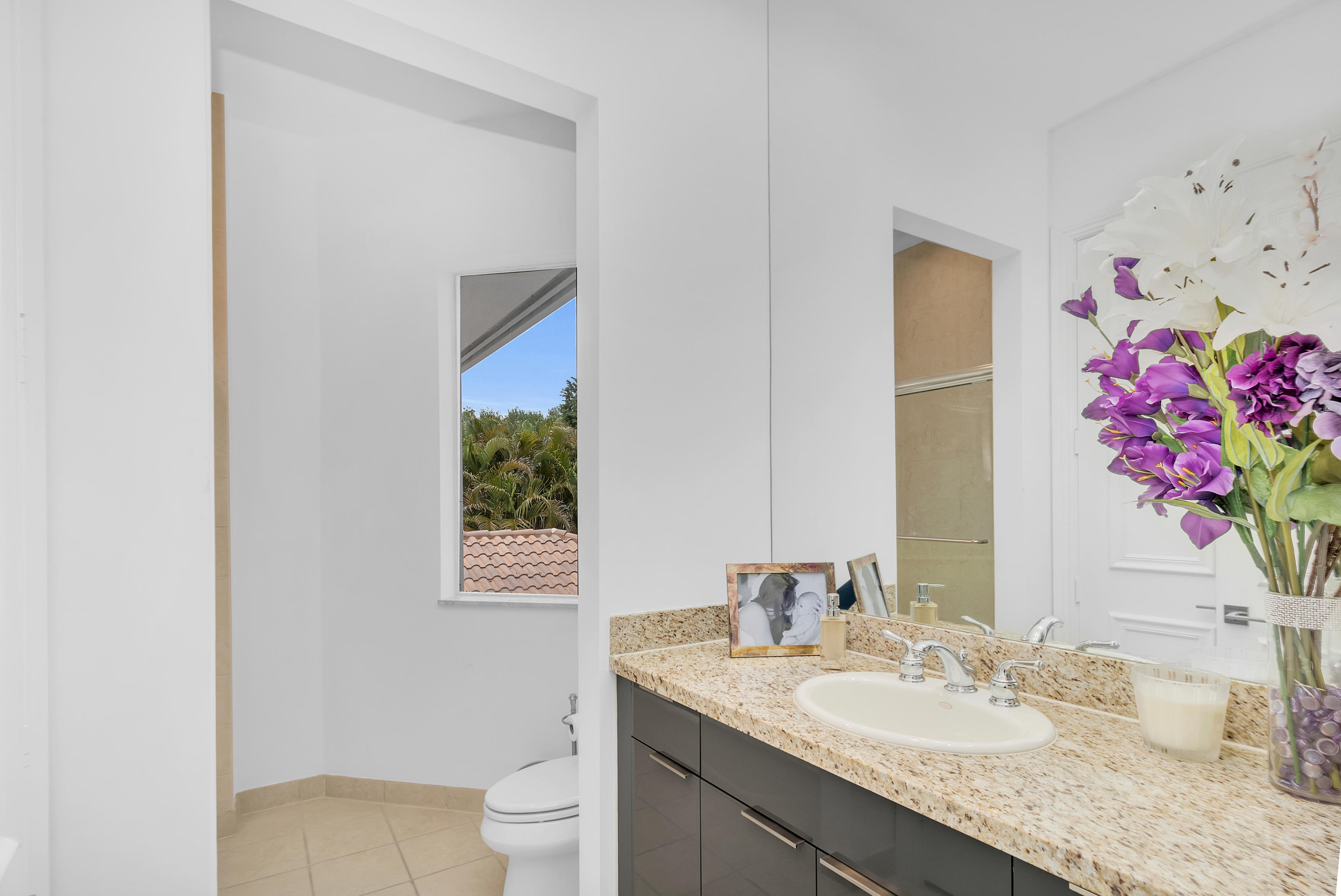 17729 Middlebrook Way Boca Raton, FL 33496 - Photo 49 of 88 a bathroom with a granite countertop sink mirror and toilet