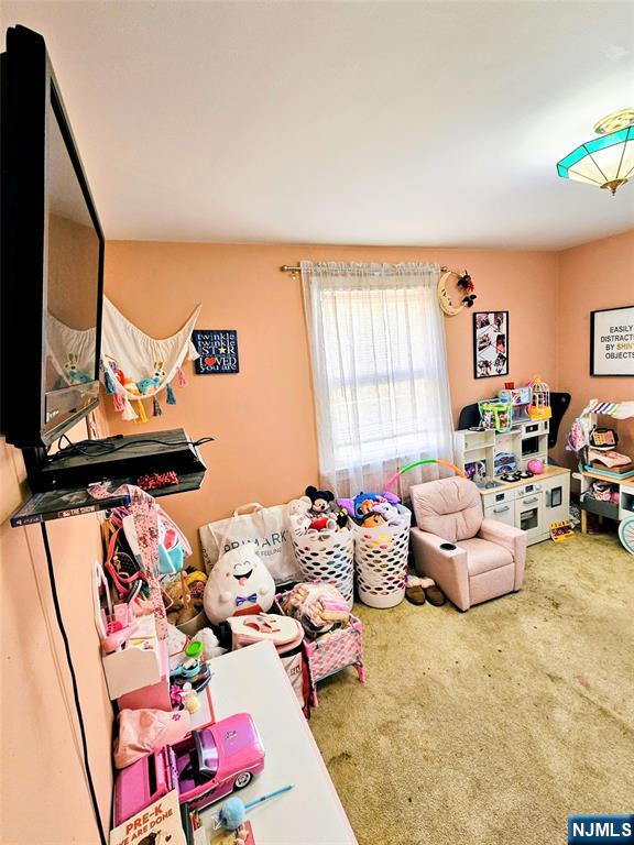 72 Front Street, Unit 2 North Arlington, NJ 07031 - Photo 14 of 14 a bedroom with furniture toys and a large window