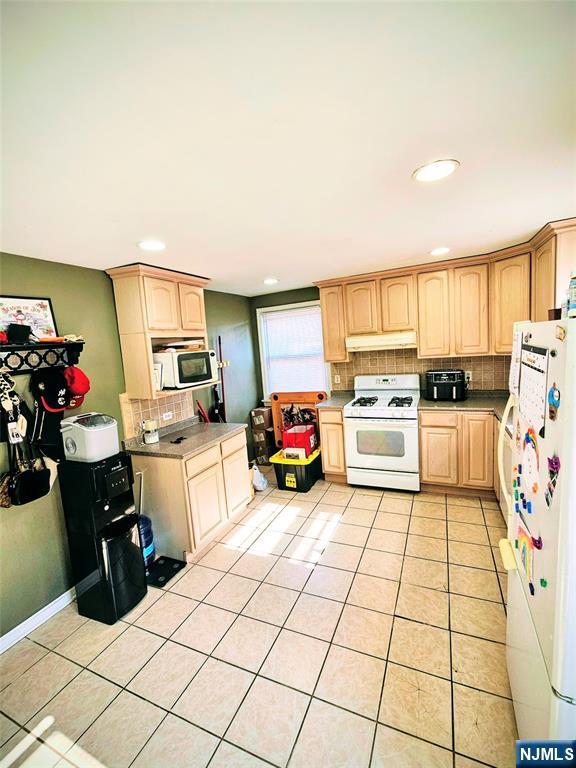 72 Front Street, Unit 2 North Arlington, NJ 07031 - Photo 4 of 14 a kitchen with stainless steel appliances a sink counter top space and cabinets