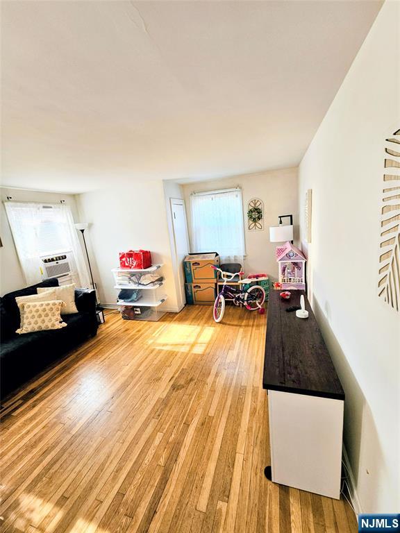 72 Front Street, Unit 2 North Arlington, NJ 07031 - Photo 7 of 14 a living room with furniture and a flat screen tv