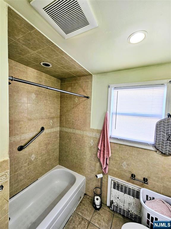 72 Front Street, Unit 2 North Arlington, NJ 07031 - Photo 10 of 14 a bathroom with a bathtub and shower
