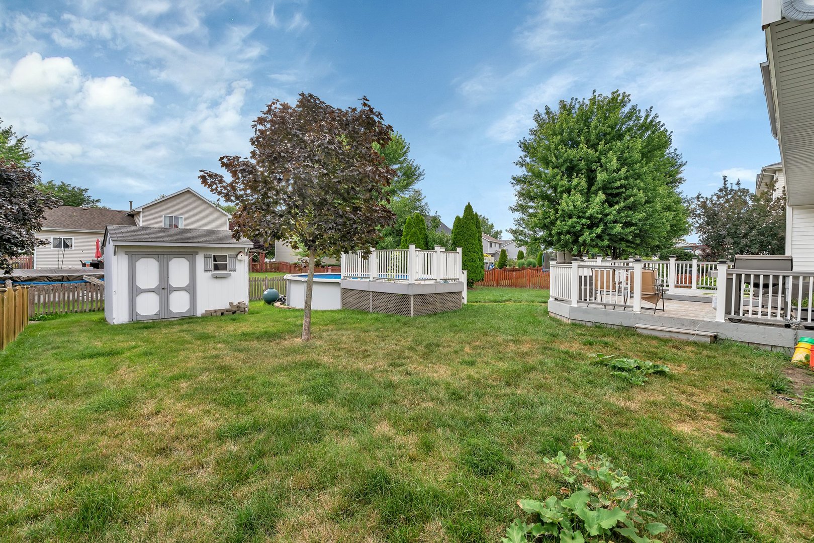 25940 South Bell Road Channahon, IL 60410 - Photo 27 of 29 a view of a house with a yard and fence