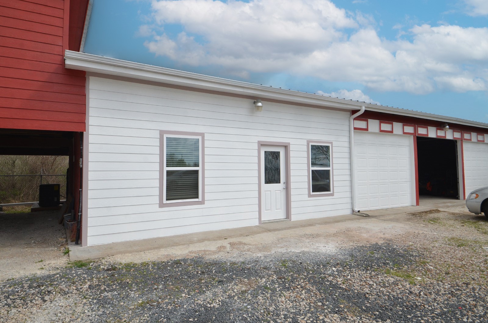 2002 West Airline County Road 55 Rosharon, TX 77583 - Photo 3 of 23 a view of house with backyard and glass windows
