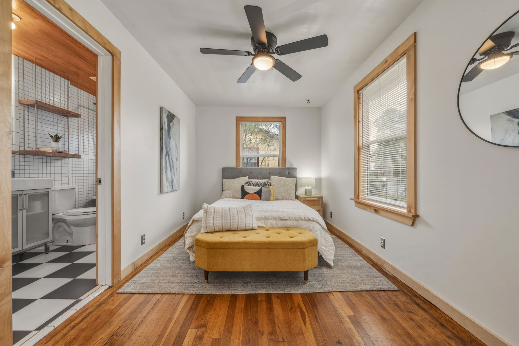 4806 Santa Anna Street Austin, TX 78721 - Photo 11 of 35 Bedroom featuring ceiling fan, wood flooring, and shared bath