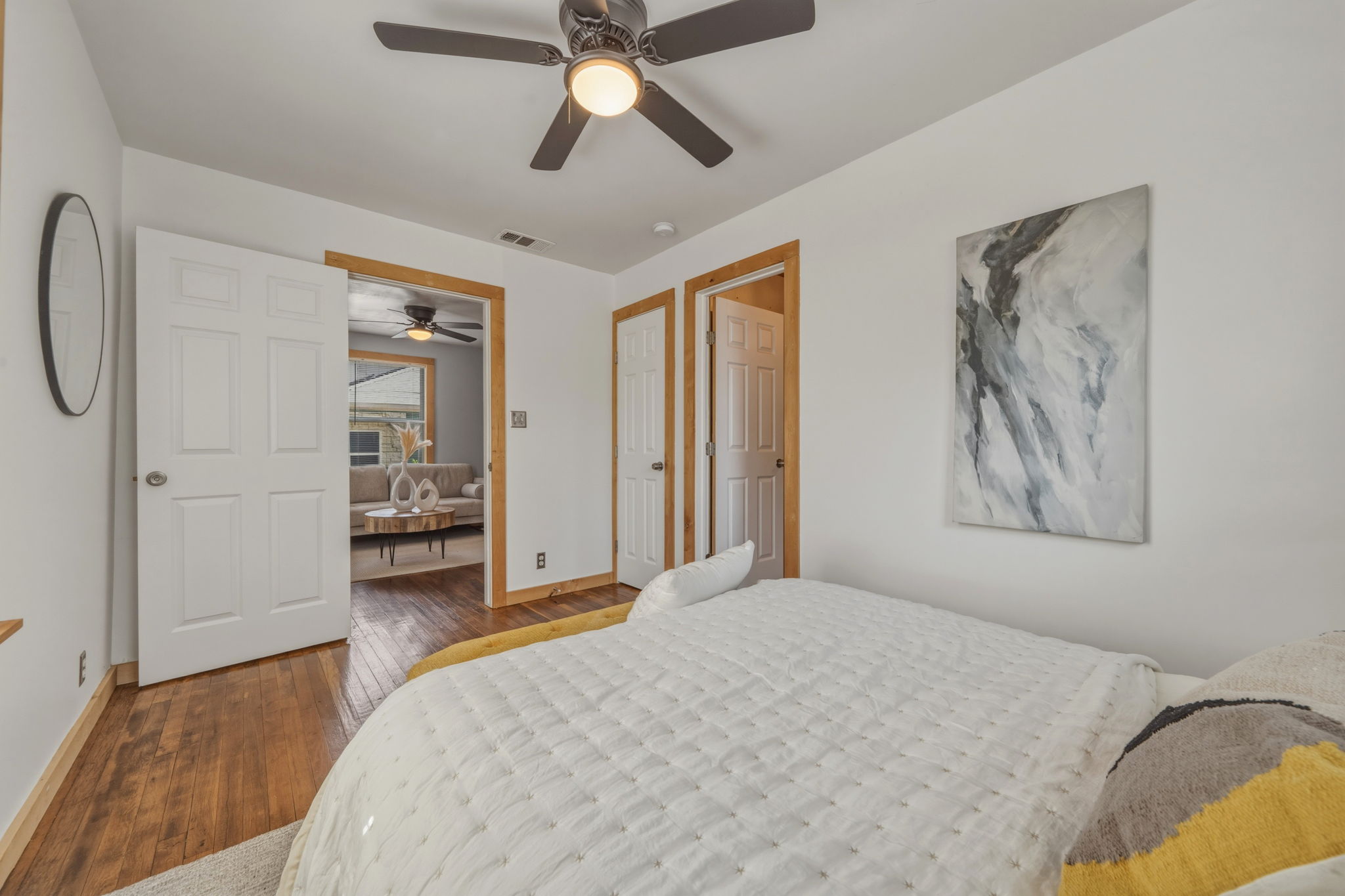 4806 Santa Anna Street Austin, TX 78721 - Photo 14 of 35 a bedroom with a bed and a chandelier