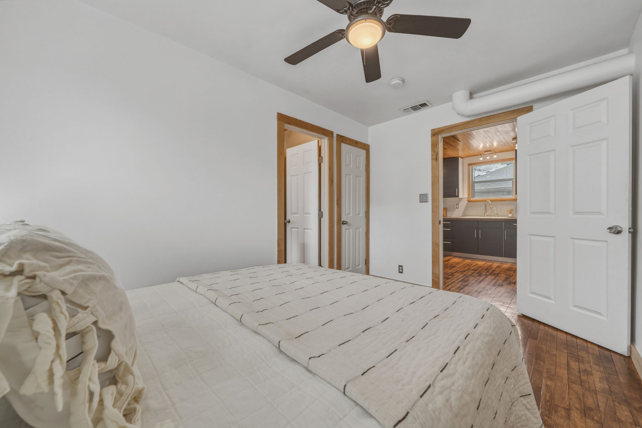 4806 Santa Anna Street Austin, TX 78721 - Photo 19 of 35 a bedroom with a large bed and a window