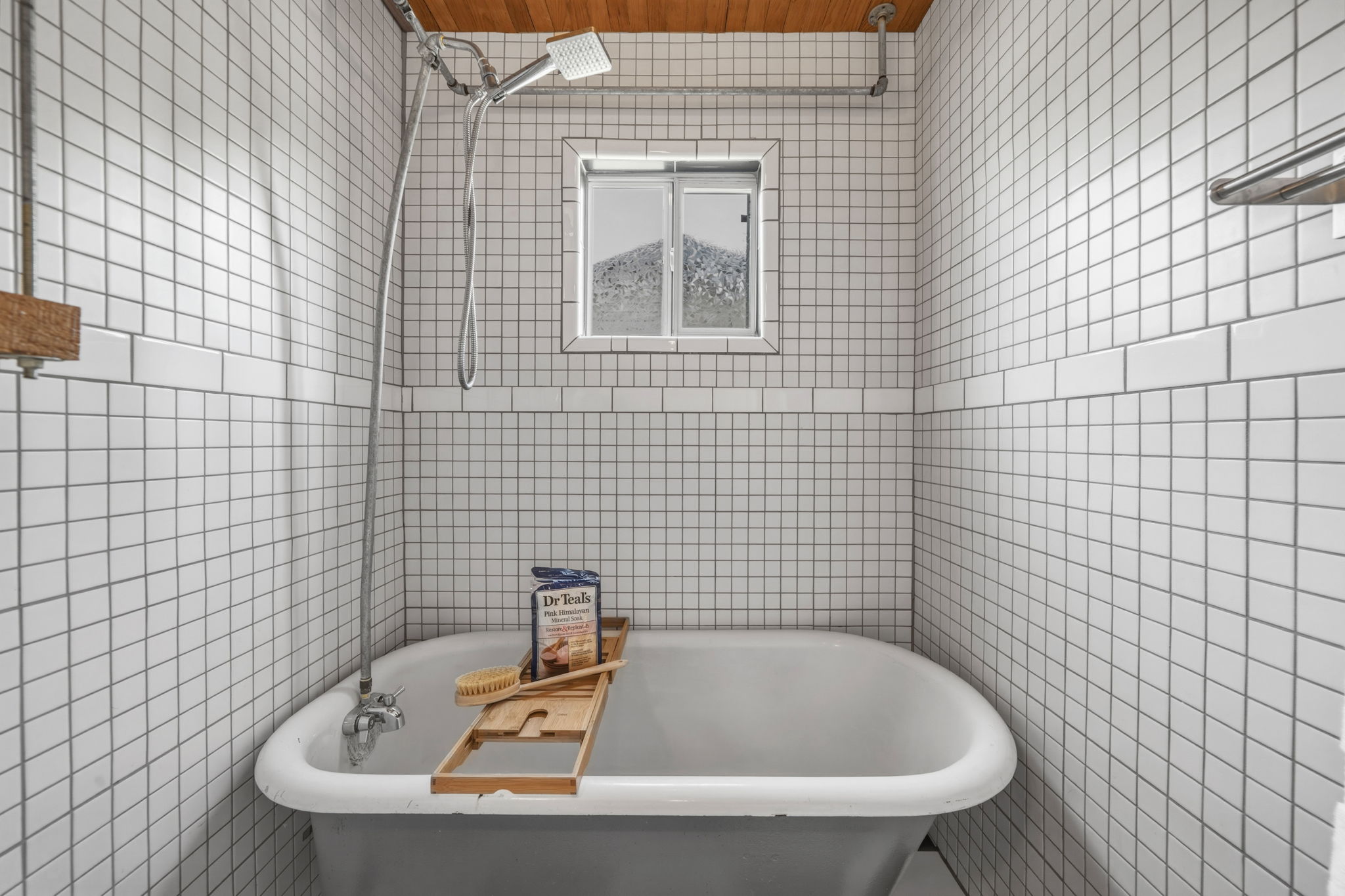 4806 Santa Anna Street Austin, TX 78721 - Photo 23 of 35 Full bath featuring tile walls, a claw-foot bath / shower vanity and wooden ceiling