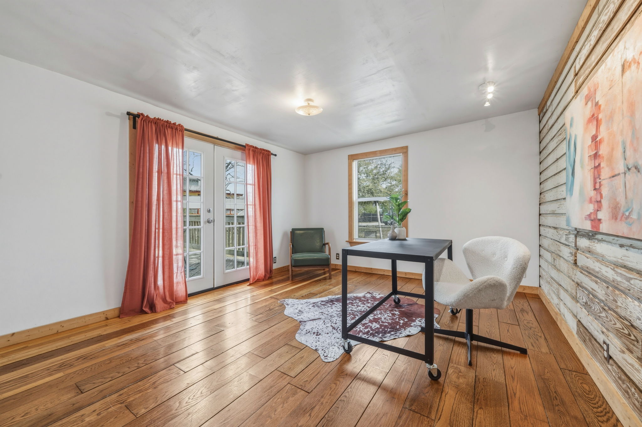 4806 Santa Anna Street Austin, TX 78721 - Photo 24 of 35 a living room with furniture and a wooden floor
