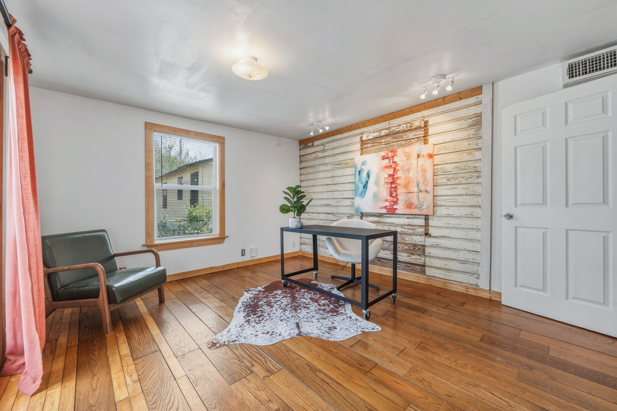4806 Santa Anna Street Austin, TX 78721 - Photo 25 of 35 a bedroom with furniture and a window