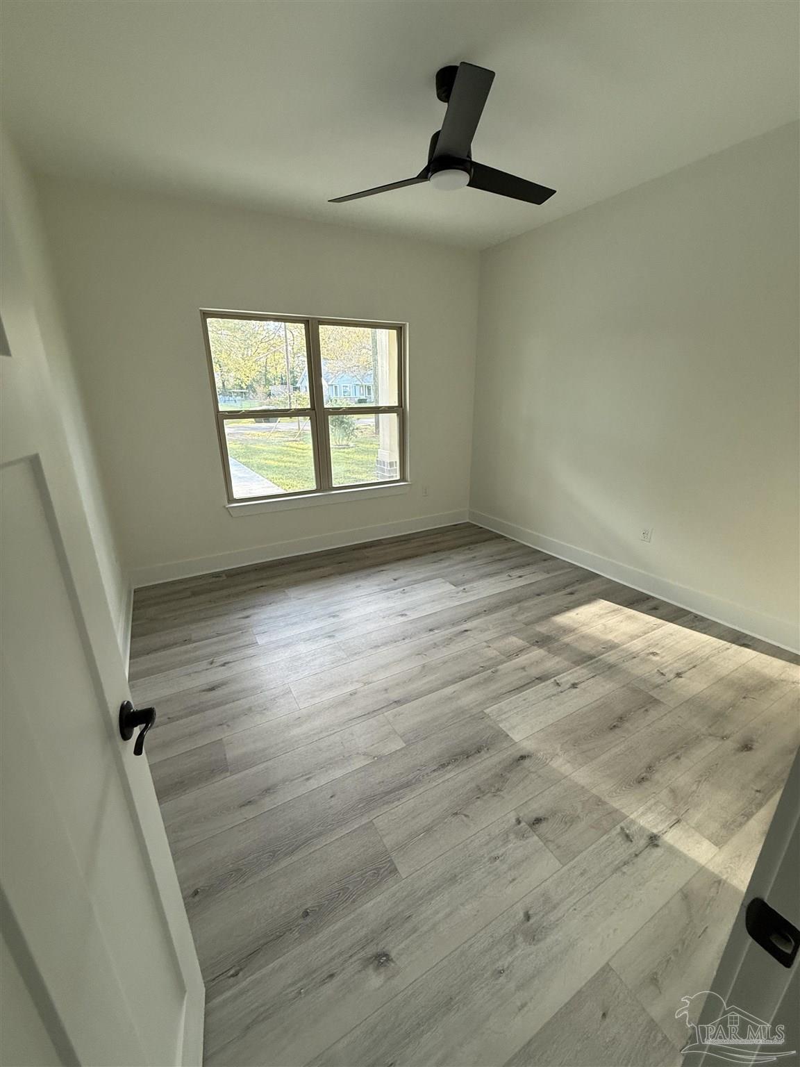 8636 Messick Street, Unit A Pensacola, FL 32534 - Photo 13 of 13 wooden floor in an empty room