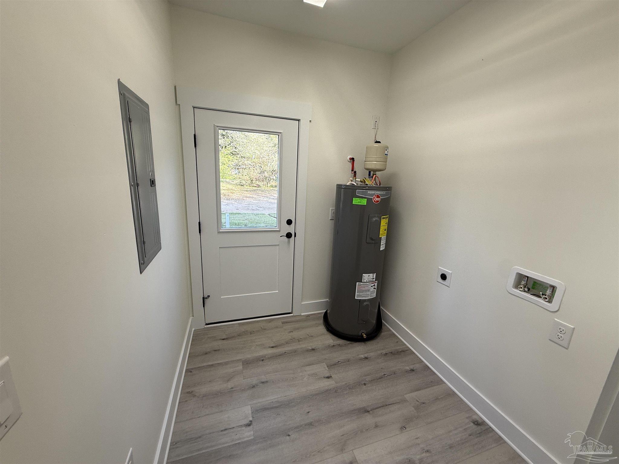 8636 Messick Street, Unit A Pensacola, FL 32534 - Photo 5 of 13 a view of an empty room with wooden floor and a window