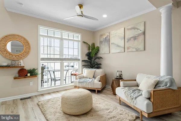 a living room with furniture and a window