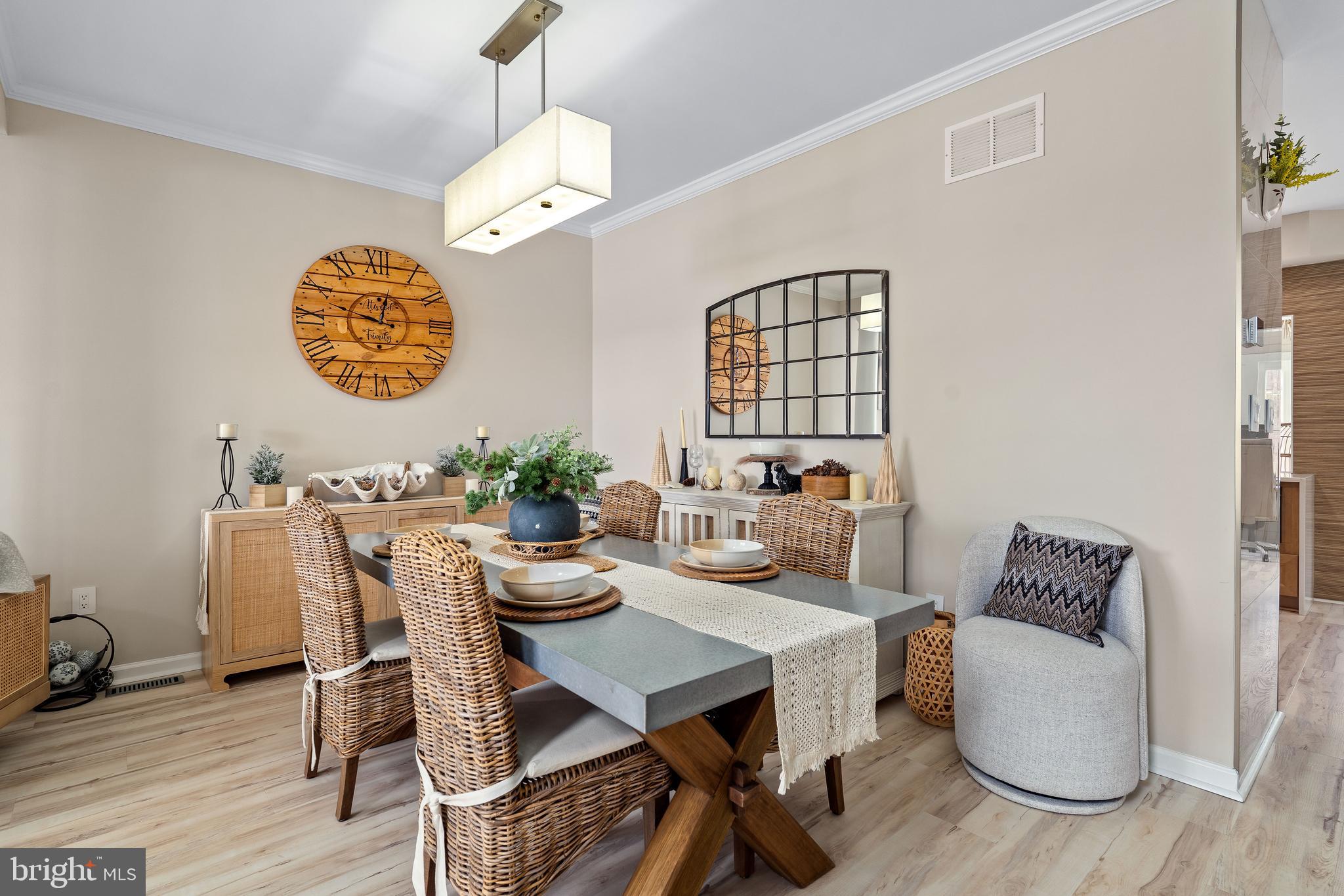 303 Beacon Point Drive Perryville, MD 21903 - Photo 13 of 43 a view of a dining room with furniture window and wooden floor