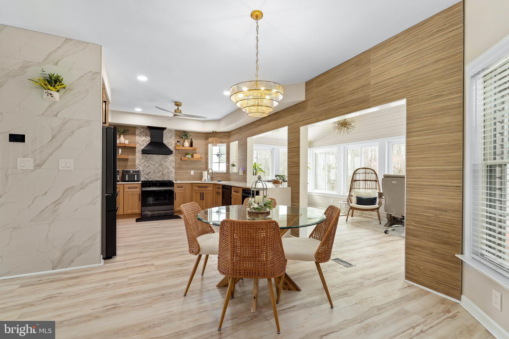 303 Beacon Point Drive Perryville, MD 21903 - Photo 19 of 43 a view of a dining room with furniture window and wooden floor
