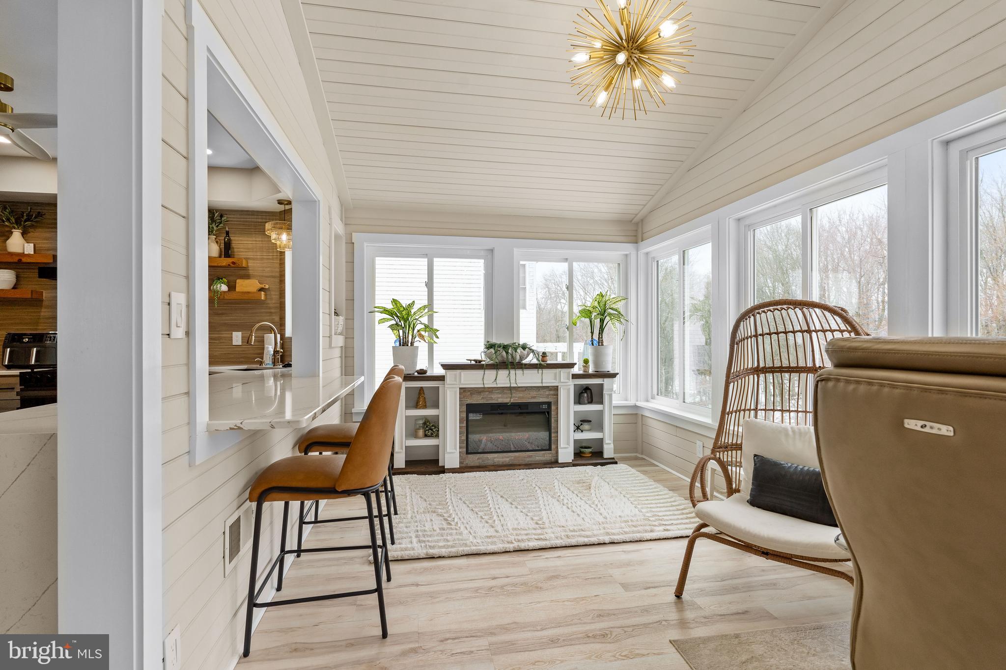 303 Beacon Point Drive Perryville, MD 21903 - Photo 25 of 43 a living room with furniture and a fireplace