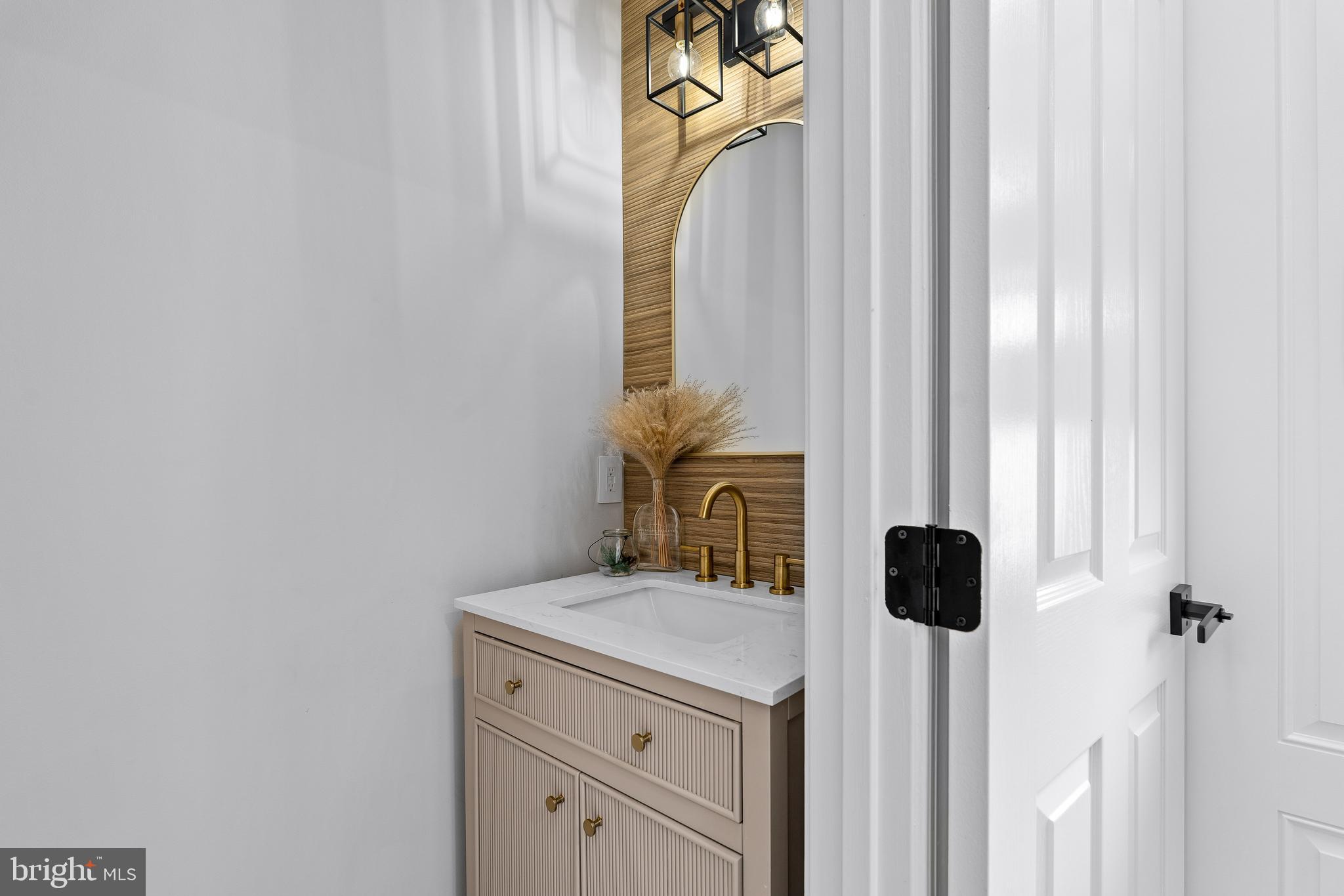 303 Beacon Point Drive Perryville, MD 21903 - Photo 27 of 43 a bathroom with a sink and a mirror