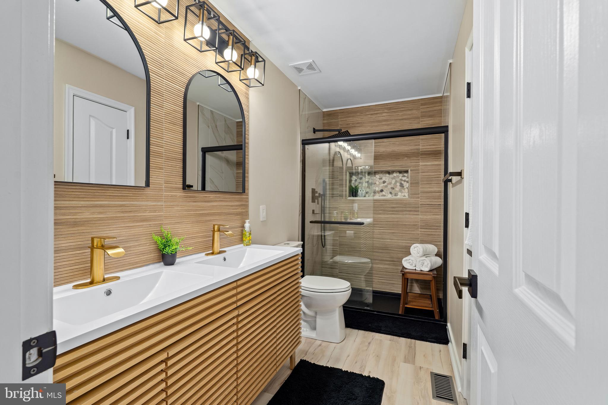 303 Beacon Point Drive Perryville, MD 21903 - Photo 29 of 43 a bathroom with a sink and a mirror