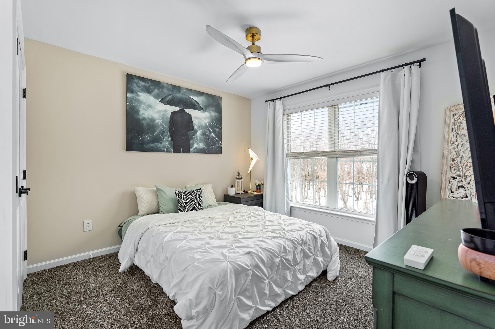 303 Beacon Point Drive Perryville, MD 21903 - Photo 30 of 43 a bedroom with a large bed and a window