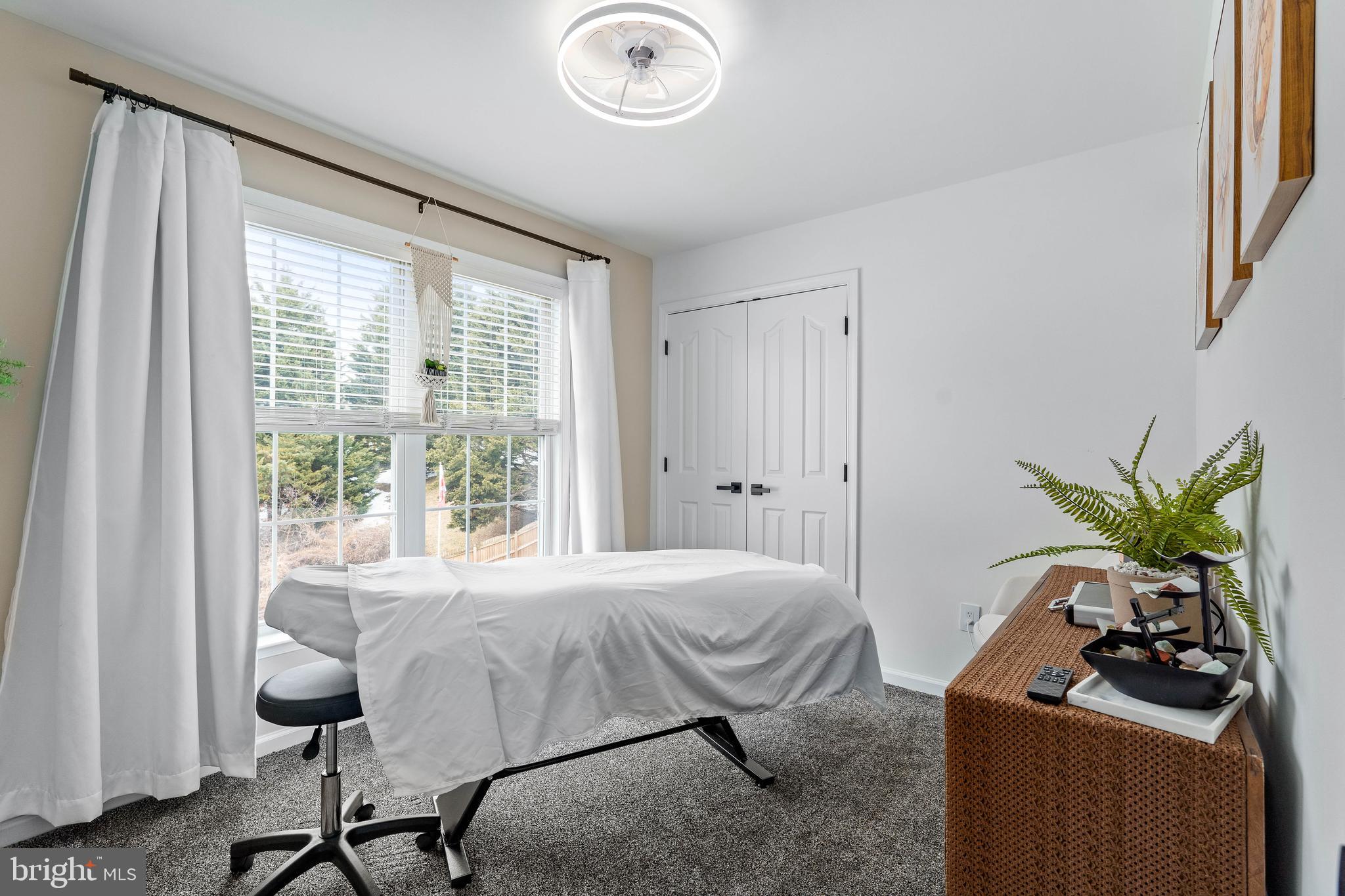 303 Beacon Point Drive Perryville, MD 21903 - Photo 31 of 43 a bedroom with a bed and a chandelier