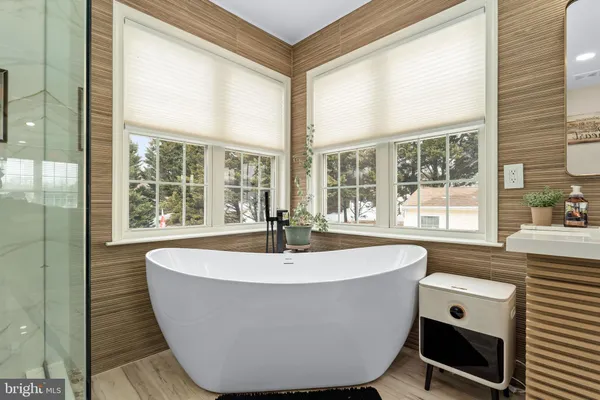 a bed room with a bed and mirror