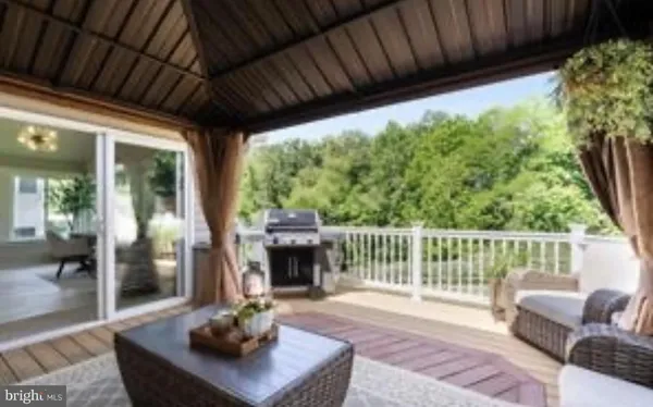 a living room with furniture a fireplace and a table