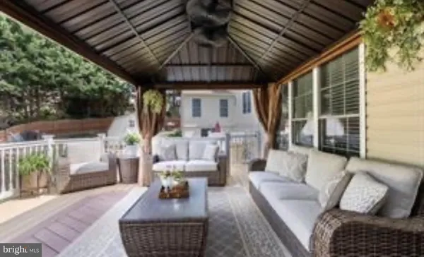 a outdoor living space with furniture and a couch