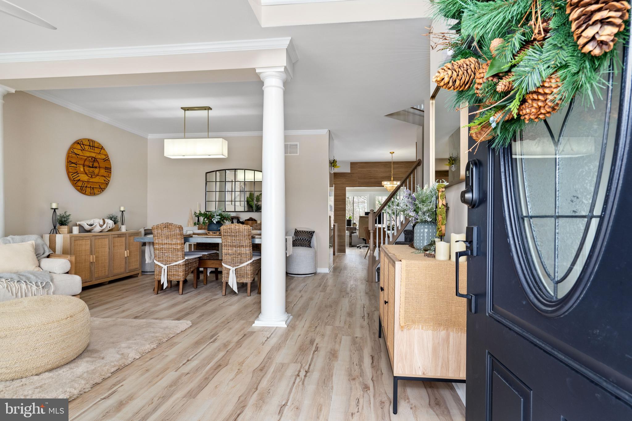 303 Beacon Point Drive Perryville, MD 21903 - Photo 9 of 43 a living room with furniture a table and wooden floor