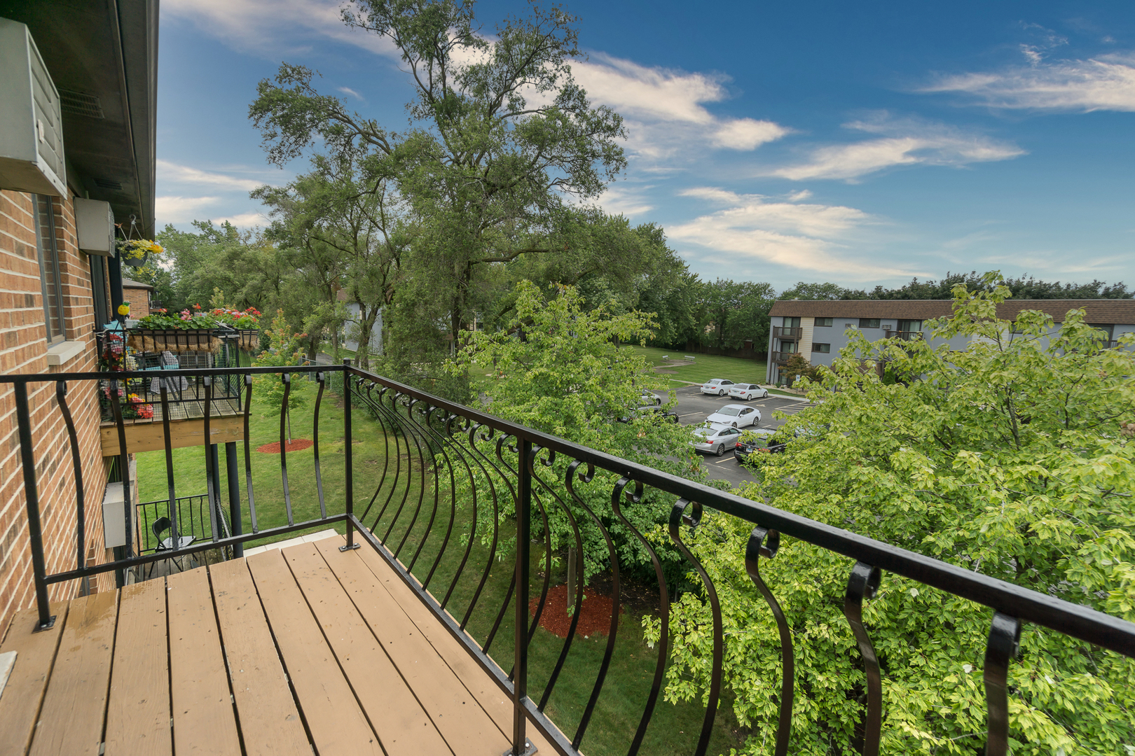922 West Irving Park Road, Unit 303 Bensenville, IL 60106 - Photo 15 of 16 a view of a balcony with wooden floor