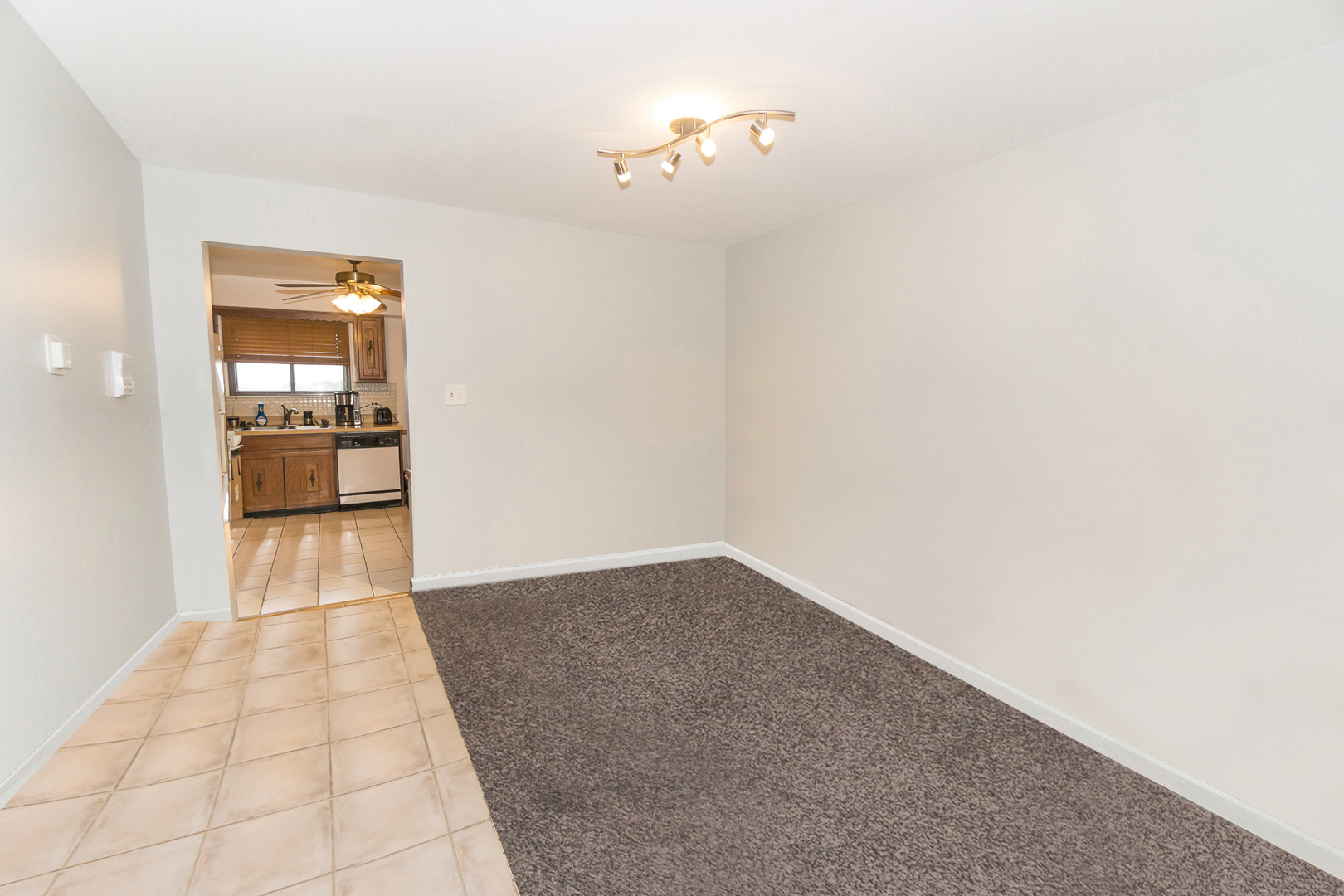 922 West Irving Park Road, Unit 303 Bensenville, IL 60106 - Photo 4 of 16 a view of a hallway with a chandelier