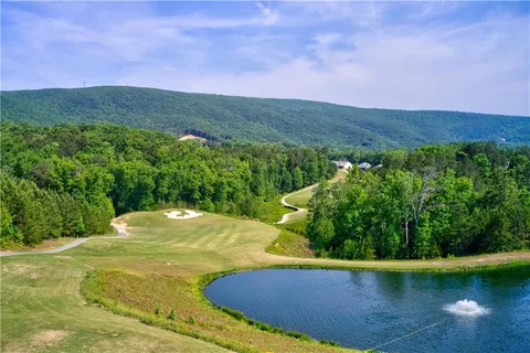 an aerial view of house with yard swimming pool and outdoor seating