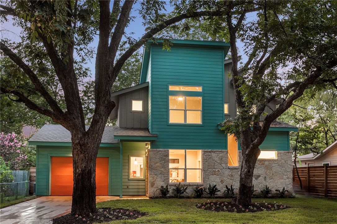1124 Mark Street Austin, TX 78721 - Photo 1 of 1 a front view of a house with a garden