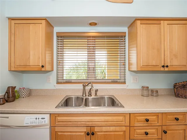 a kitchen with a sink and a window