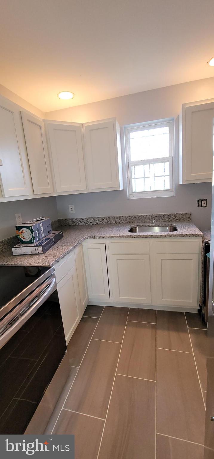 5501 Jay Street Northeast Washington, DC 20019 - Photo 5 of 46 Porcelain Kitchen floors