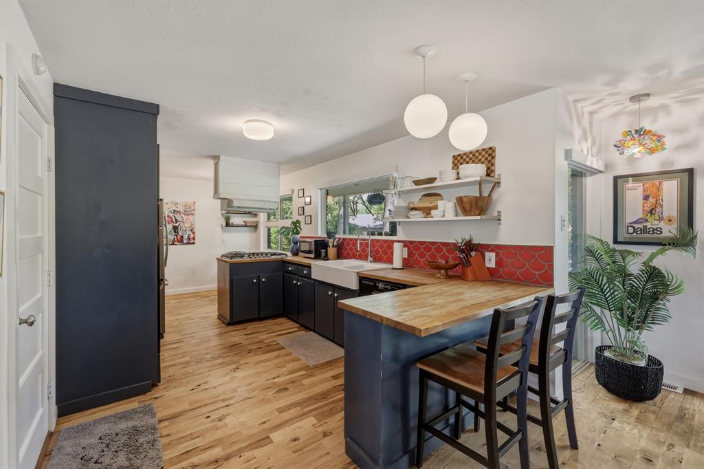 2320 Chart Drive Dallas, TX 75228 - Photo 11 of 34 a kitchen with a table and chairs in it