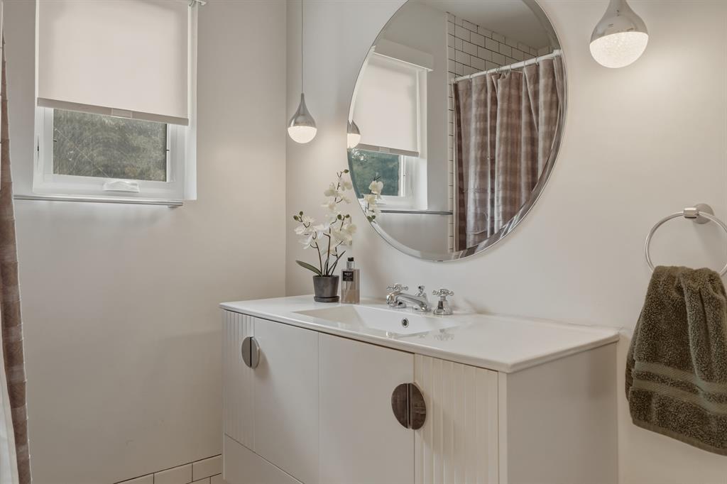 2320 Chart Drive Dallas, TX 75228 - Photo 15 of 34 a bathroom with a sink and a mirror