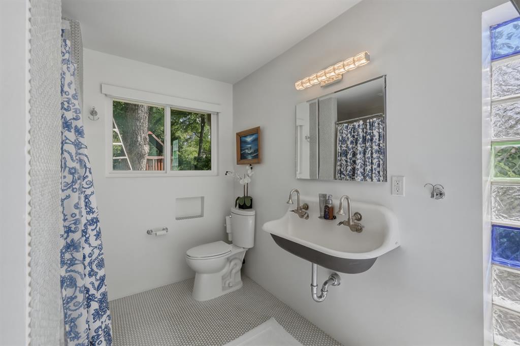 2320 Chart Drive Dallas, TX 75228 - Photo 18 of 34 a bathroom with a sink toilet and mirror