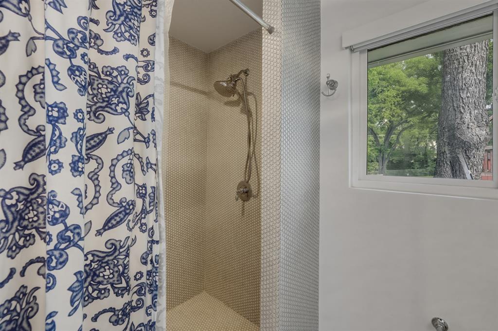 2320 Chart Drive Dallas, TX 75228 - Photo 19 of 34 a bathroom with a shower curtain