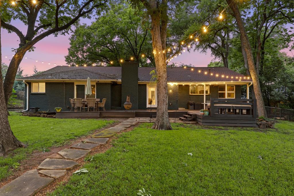 2320 Chart Drive Dallas, TX 75228 - Photo 23 of 34 a front view of a house with a garden and patio