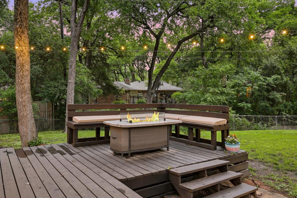 2320 Chart Drive Dallas, TX 75228 - Photo 27 of 34 a view of a wooden deck with chairs and a yard