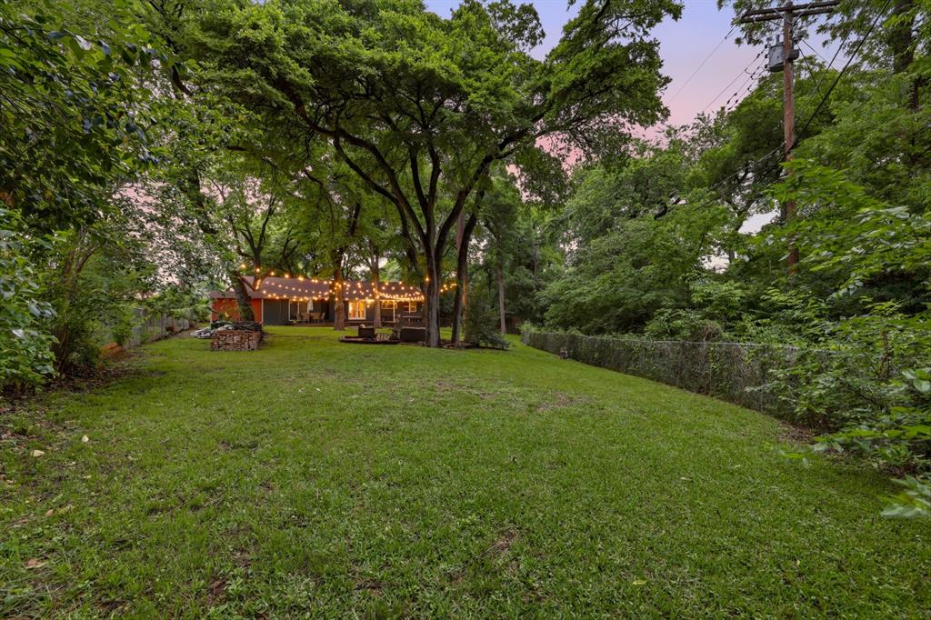 2320 Chart Drive Dallas, TX 75228 - Photo 32 of 34 a view of a yard with a large tree