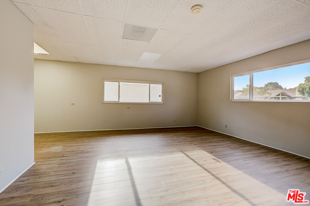 1817 Rolling Hills Drive Fullerton, CA 92835 - Photo 15 of 29 an empty room with wooden floor and windows