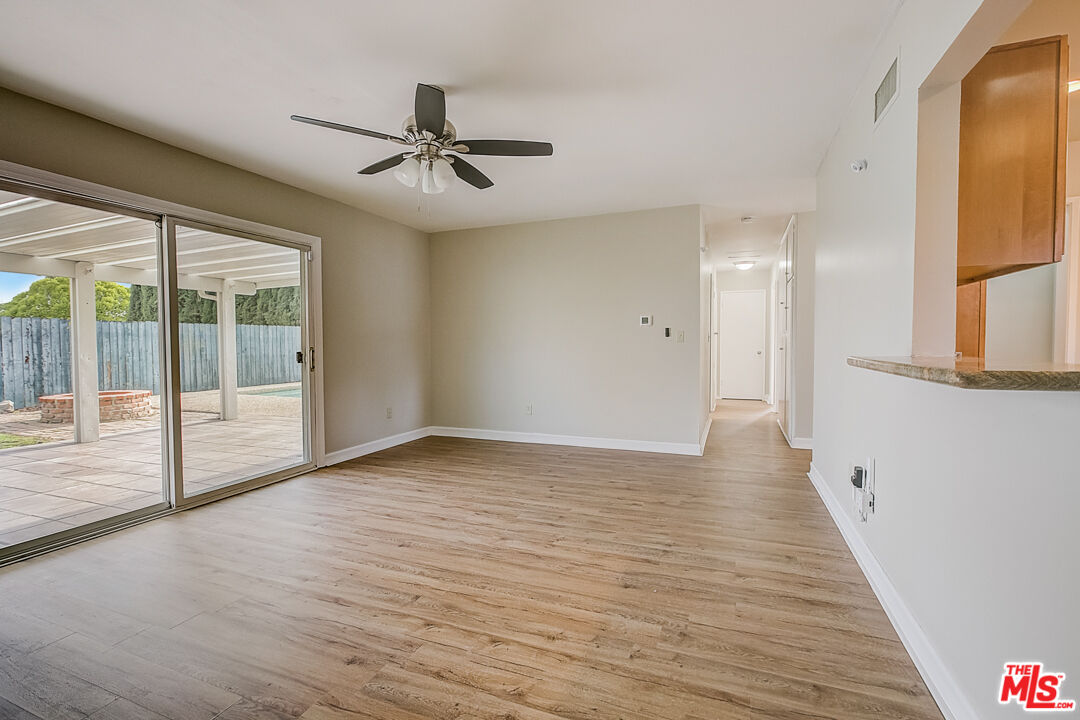 1817 Rolling Hills Drive Fullerton, CA 92835 - Photo 17 of 29 a view of an empty room with wooden floor and a window