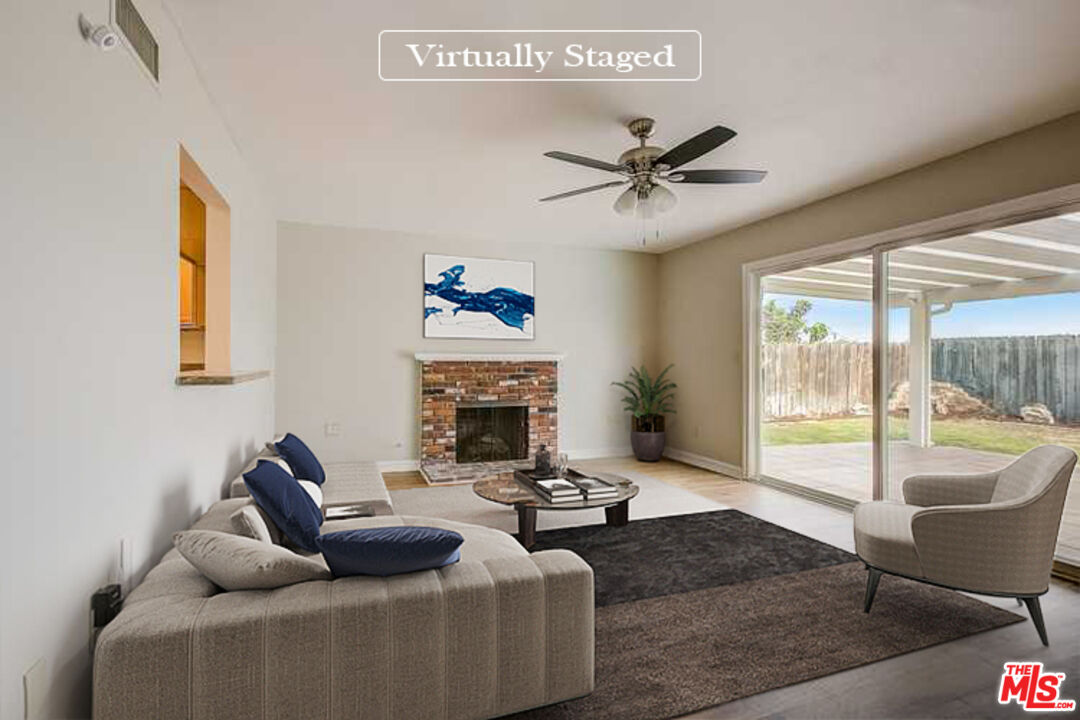 1817 Rolling Hills Drive Fullerton, CA 92835 - Photo 2 of 29 a living room with furniture and a fireplace