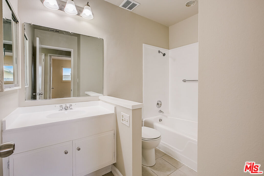 1817 Rolling Hills Drive Fullerton, CA 92835 - Photo 21 of 29 a bathroom with a sink a toilet and shower