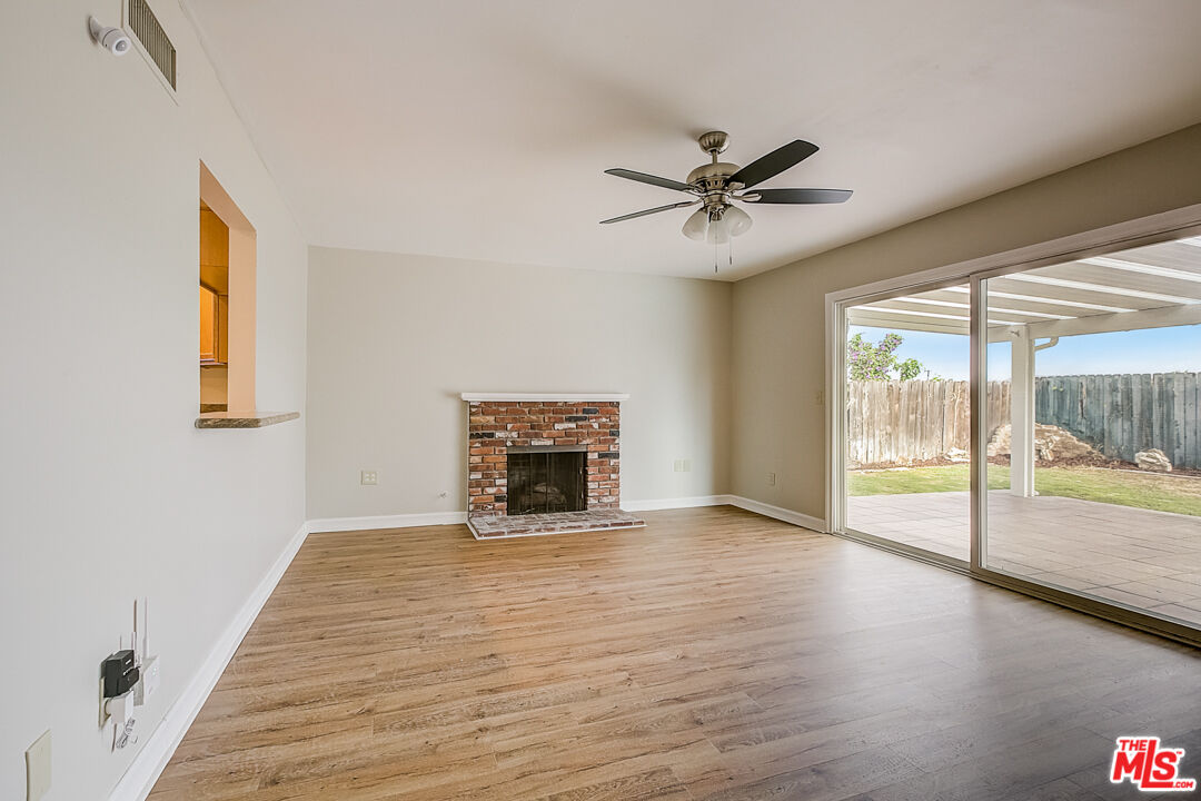 1817 Rolling Hills Drive Fullerton, CA 92835 - Photo 6 of 29 a view of an empty room with a window and wooden floor