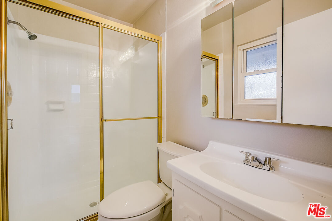 1817 Rolling Hills Drive Fullerton, CA 92835 - Photo 8 of 29 a bathroom with a sink a mirror and a toilet